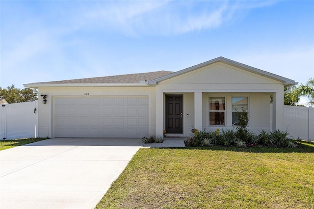 view of front of house featuring fence, stucco siding, concrete driveway, a front lawn, and a garage