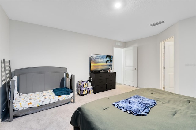 carpeted bedroom with visible vents