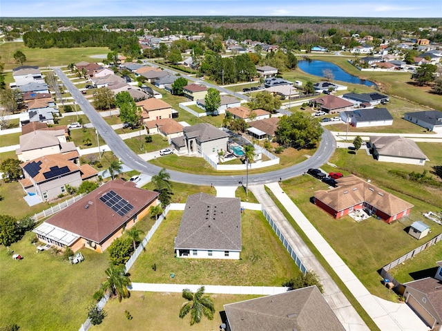 bird's eye view featuring a residential view and a water view