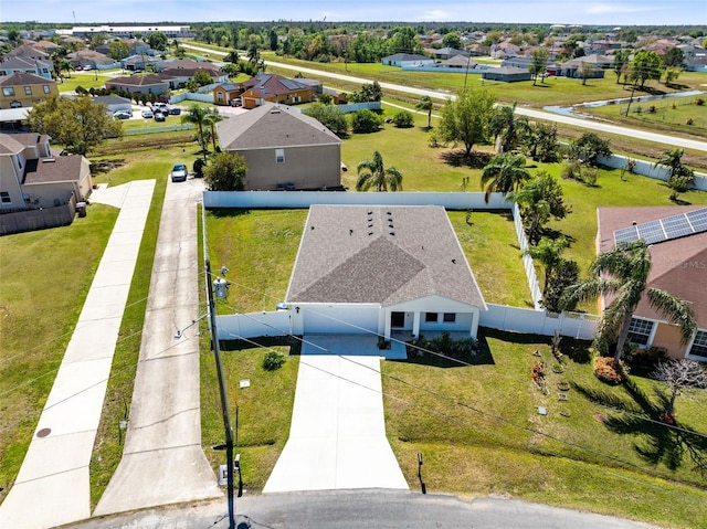 birds eye view of property with a residential view