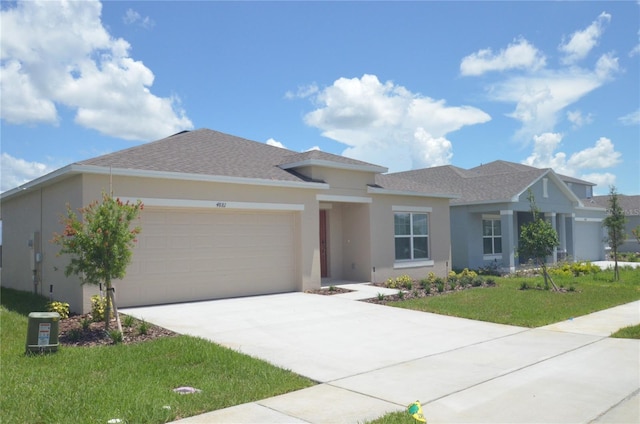 single story home with a front yard, roof with shingles, driveway, stucco siding, and a garage