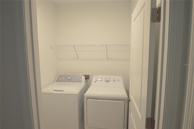 laundry area with independent washer and dryer