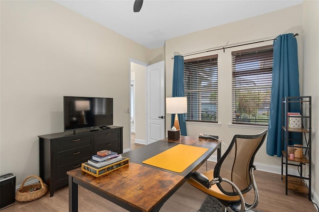 office featuring light wood-type flooring and baseboards