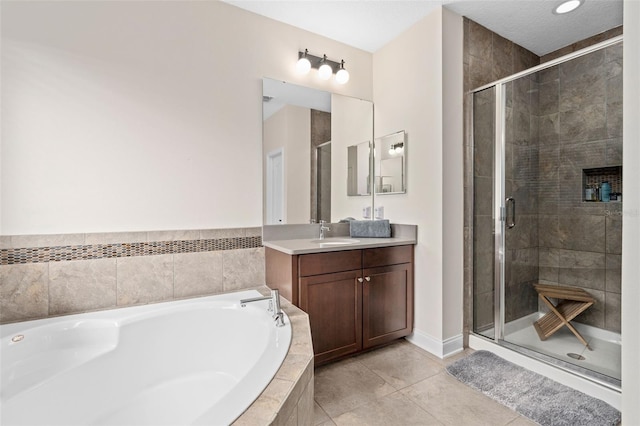 full bathroom featuring vanity, a shower stall, a bath, and tile patterned flooring