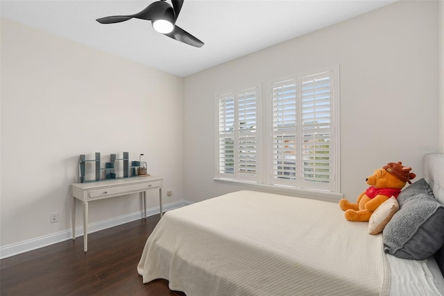 bedroom featuring dark wood finished floors, ceiling fan, and baseboards