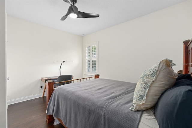 bedroom featuring a ceiling fan, baseboards, and wood finished floors