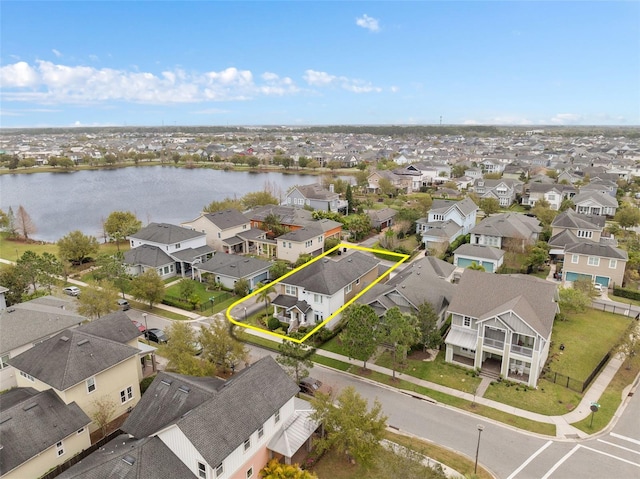 aerial view with a residential view and a water view