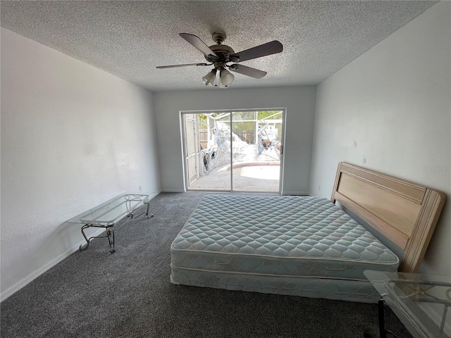 unfurnished bedroom featuring access to exterior, carpet flooring, a textured ceiling, and a ceiling fan