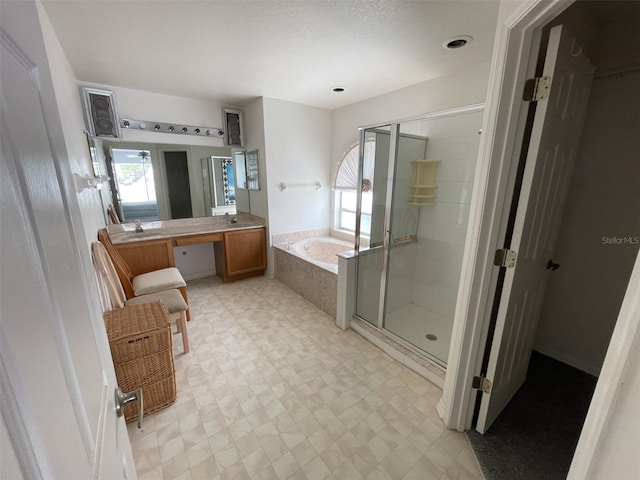 full bathroom with tile patterned floors, a stall shower, a bath, and vanity