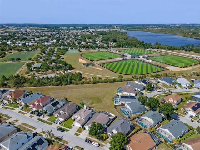 birds eye view of property featuring a residential view and a water view