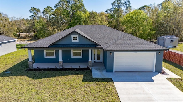 view of front of house with stucco siding, a front yard, and a garage