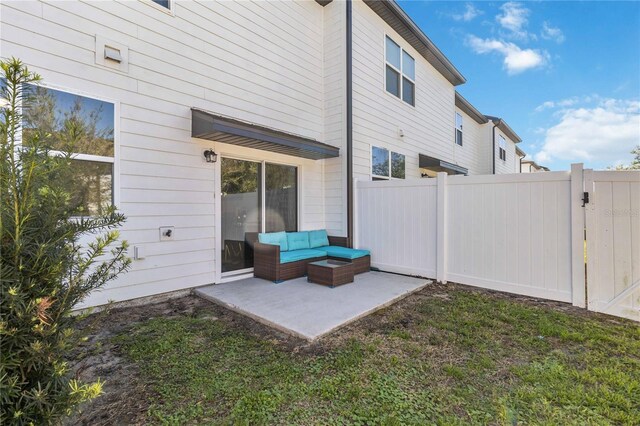 exterior space with an outdoor hangout area and fence