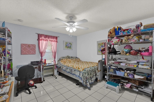 bedroom with light tile patterned flooring, a textured ceiling, and ceiling fan