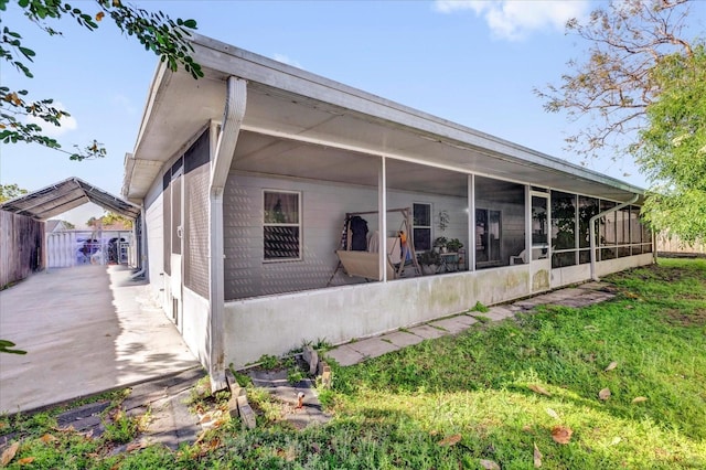 rear view of house with a sunroom