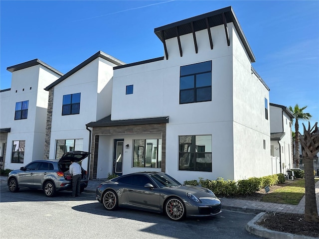 contemporary home featuring stucco siding