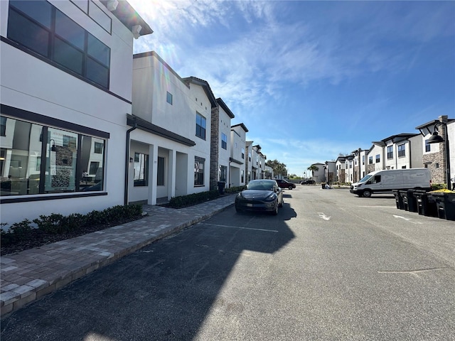 view of street with a residential view and sidewalks