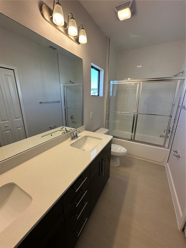 bathroom with visible vents, toilet, and a sink