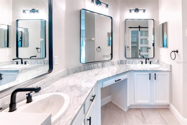 bathroom featuring double vanity and a sink