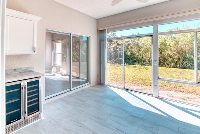 interior space featuring beverage cooler and ceiling fan