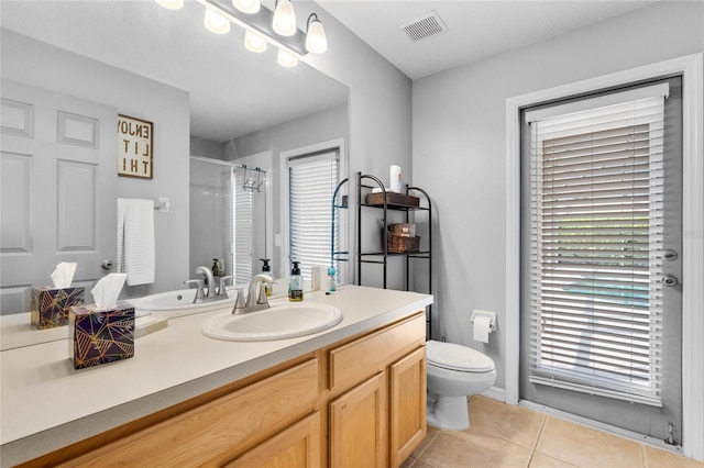 full bathroom with visible vents, a shower with curtain, toilet, tile patterned flooring, and vanity