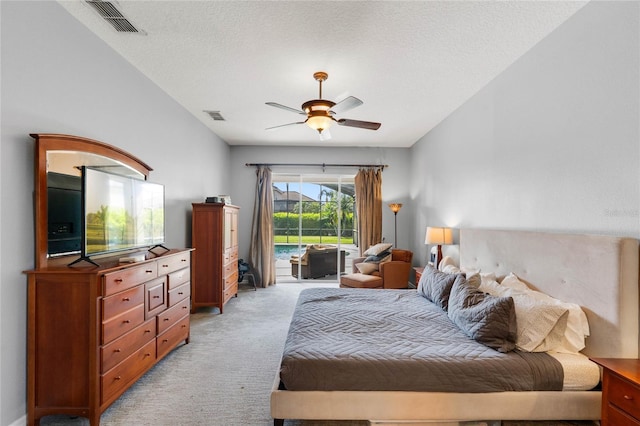 bedroom featuring access to outside, a ceiling fan, visible vents, and light carpet