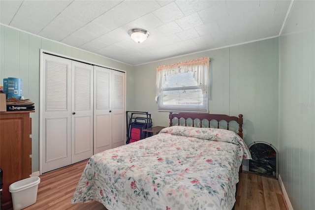 bedroom with a closet and wood finished floors