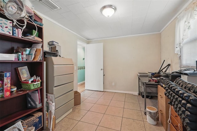 office area with light tile patterned floors, visible vents, baseboards, and ornamental molding