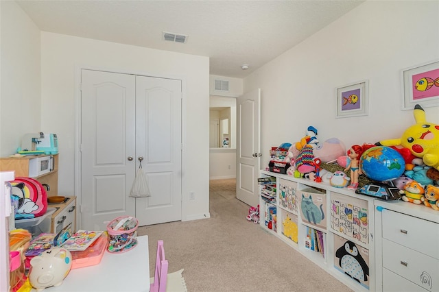 recreation room featuring carpet and visible vents