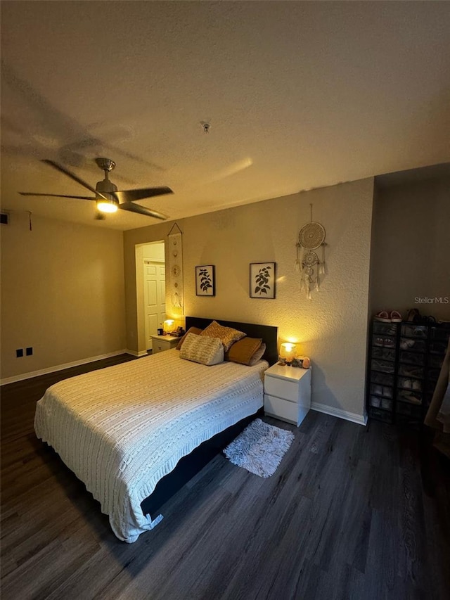 bedroom featuring a textured ceiling, a ceiling fan, baseboards, and wood finished floors