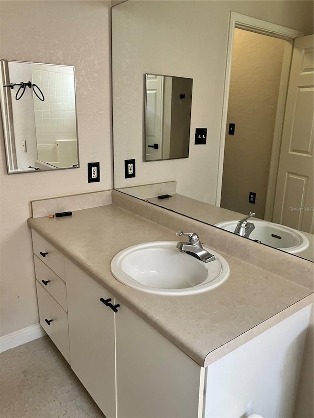 911 N Orange Ave Unit 142, Orlando, FL 32801 - bathroom featuring vanity and baseboards