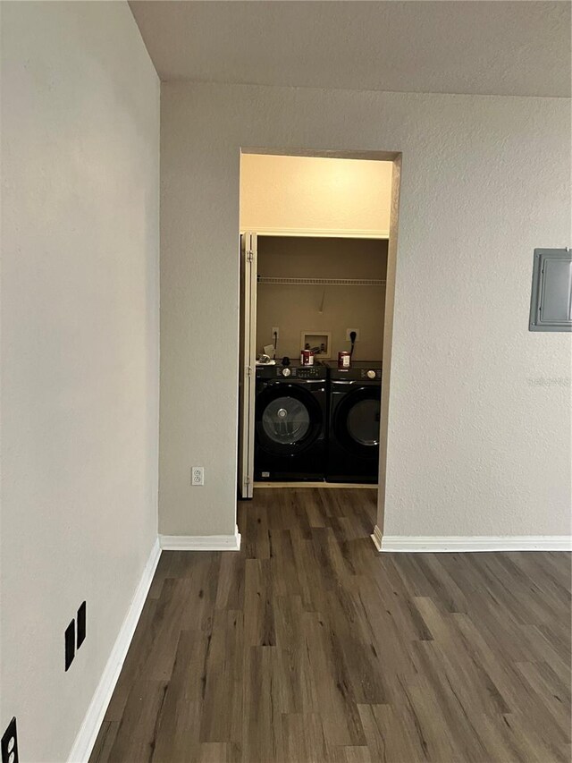 911 N Orange Ave Unit 142, Orlando, FL 32801 - laundry room with separate washer and dryer, wood finished floors, and baseboards