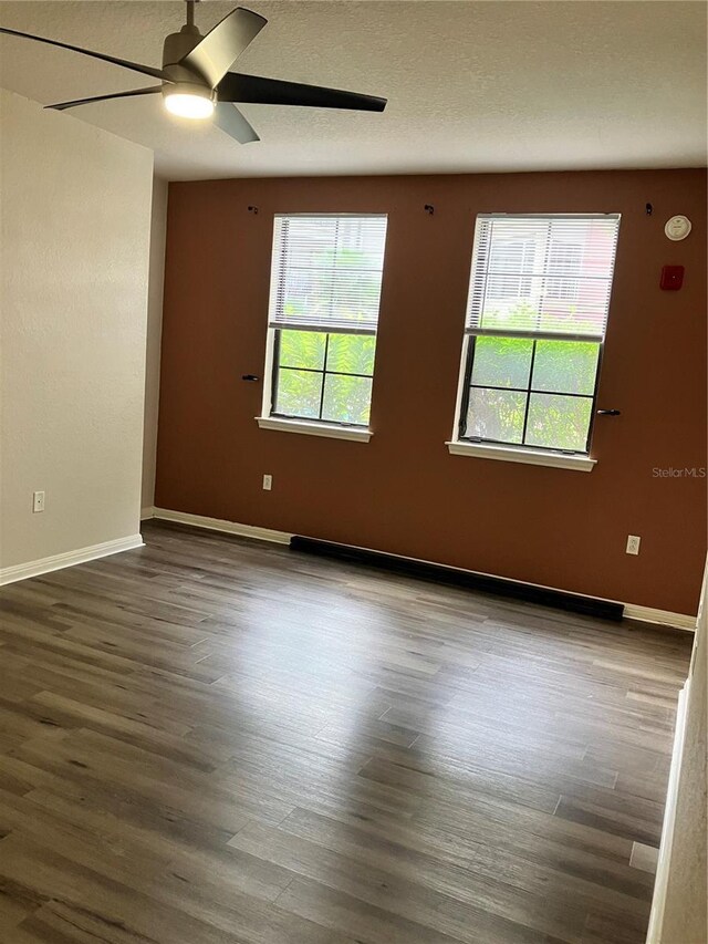 911 N Orange Ave Unit 142, Orlando, FL 32801 - unfurnished room with a ceiling fan, wood finished floors, and baseboards