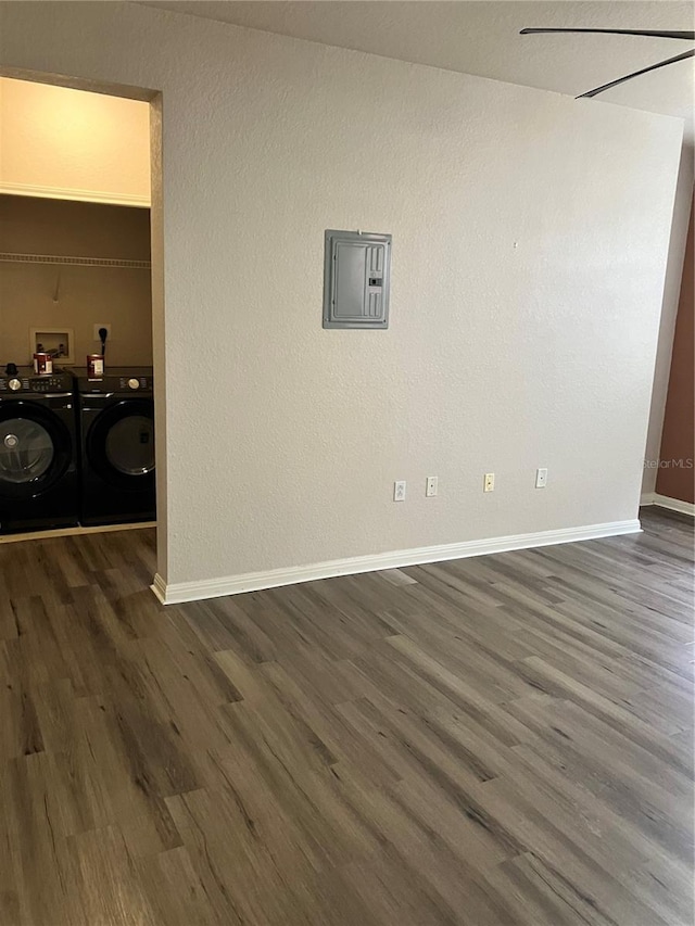 911 N Orange Ave Unit 142, Orlando, FL 32801 - unfurnished room with electric panel, dark wood-style floors, separate washer and dryer, and baseboards