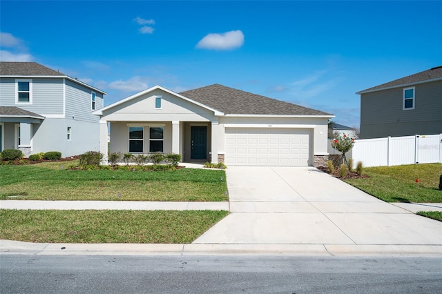 view of front of home with a garage, concrete driveway, a front lawn, and fence