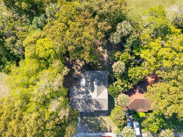 birds eye view of property with a wooded view