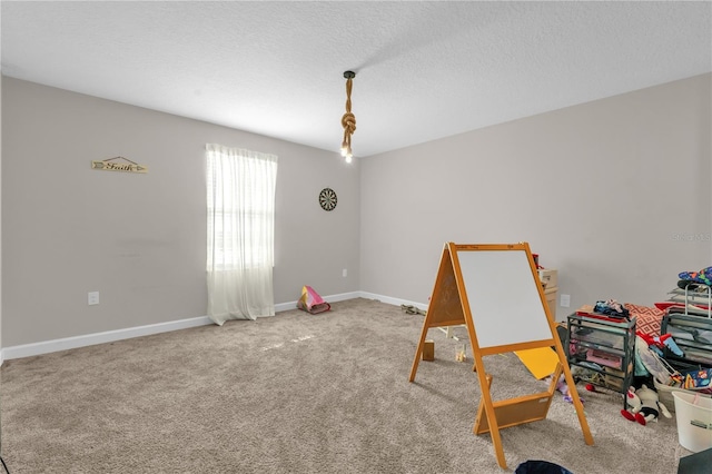 204 Taft Dr, Davenport, FL 33837 - recreation room featuring baseboards, carpet flooring, and a textured ceiling