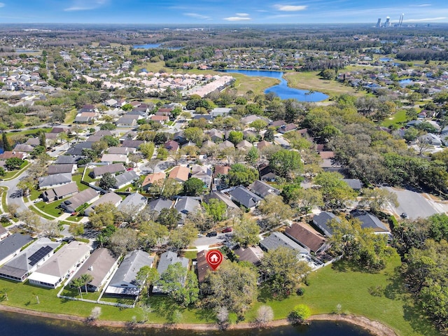 birds eye view of property with a water view and a residential view