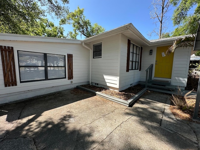 exterior space featuring crawl space and entry steps