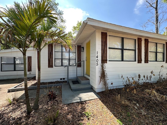 exterior space with crawl space