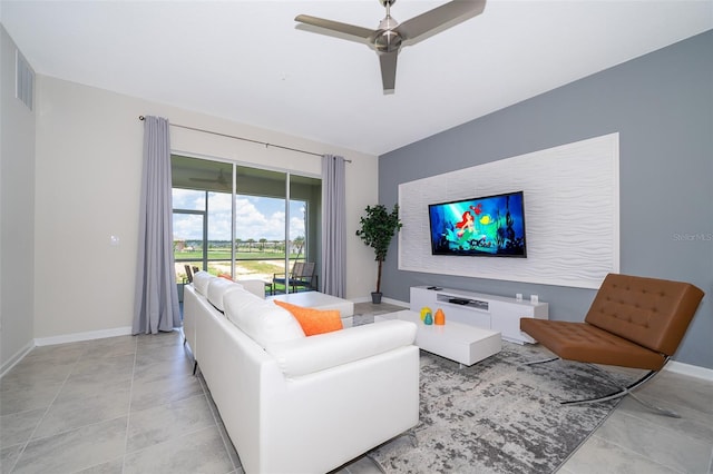 living area with visible vents, baseboards, ceiling fan, and light tile patterned flooring