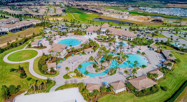 birds eye view of property featuring a residential view, golf course view, and a water view