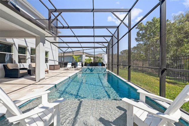 view of swimming pool with a patio area, a lanai, outdoor lounge area, and fence