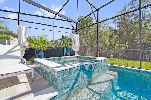 view of swimming pool featuring a patio area, glass enclosure, a pool with connected hot tub, and fence