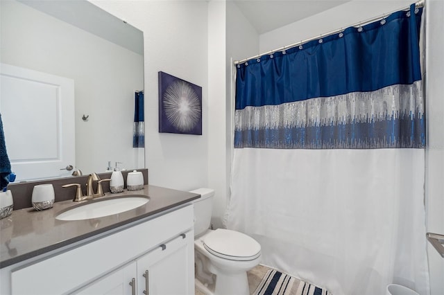 bathroom with toilet and vanity