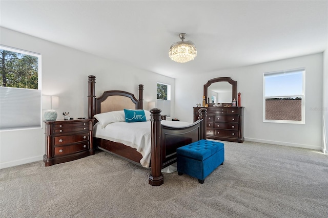 bedroom featuring baseboards and carpet floors