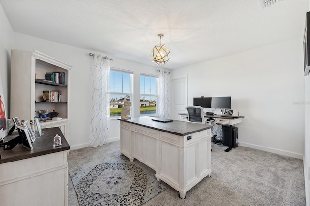 home office with baseboards, a chandelier, and light carpet