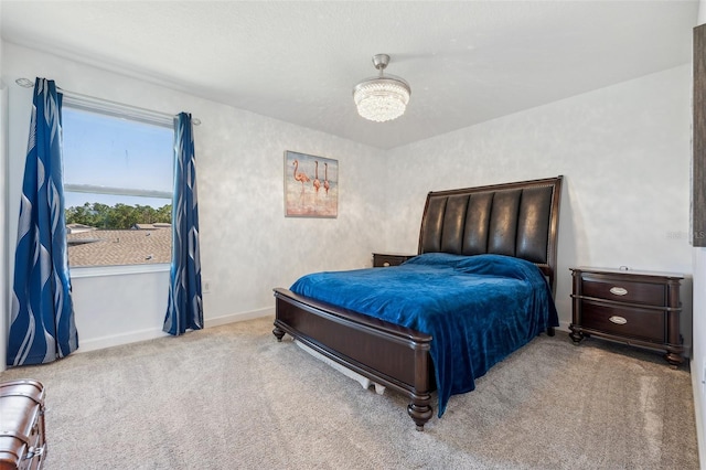 carpeted bedroom featuring baseboards