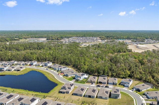 aerial view featuring a residential view, a water view, and a view of trees