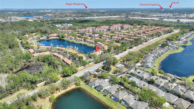 birds eye view of property with a water view