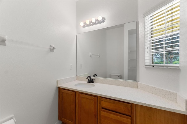 bathroom with vanity and toilet